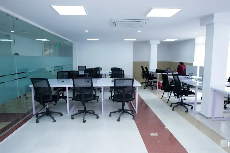 An open-plan office with people at their desks